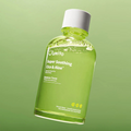 JUMISO Super Soothing Cica & Aloe Essence Toner in green background